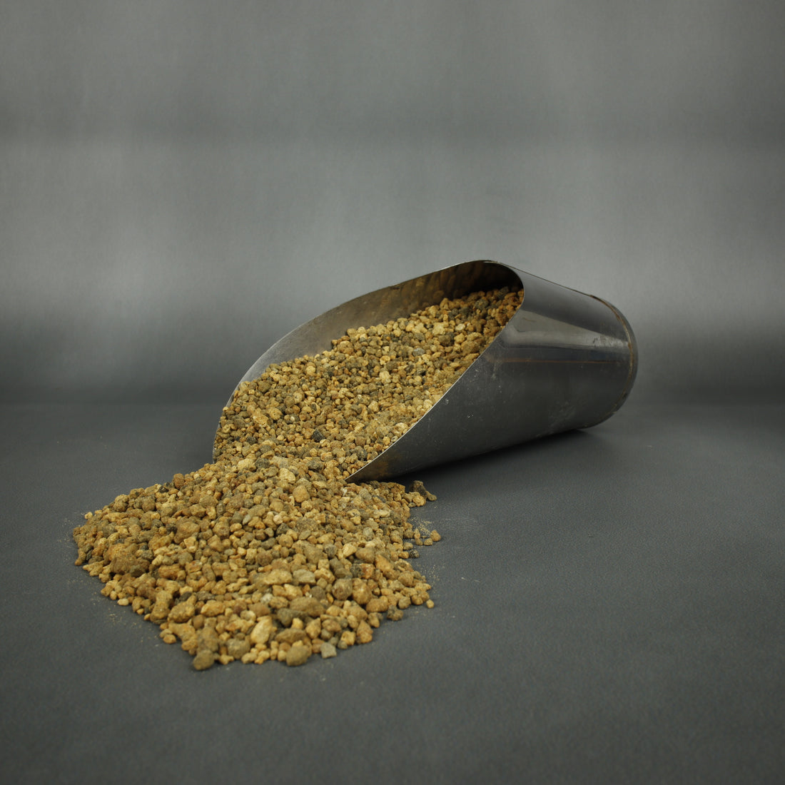 Bonsai soil in a soil scoop